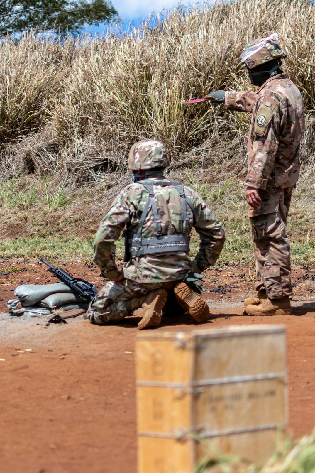 Trainer coaching a journalist through a simulated on-air conflict exercise